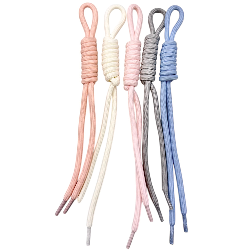 D91310A4-AD87-39FE-CF33-019D8B931D08_21 | La Vie en Rose Five pastel shoelaces with looped ends in pink, cream, pale pink, gray, and blue.