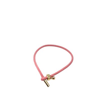 Pink cord bracelet with a gold-tone toggle clasp and small bead embellishment, lying flat.