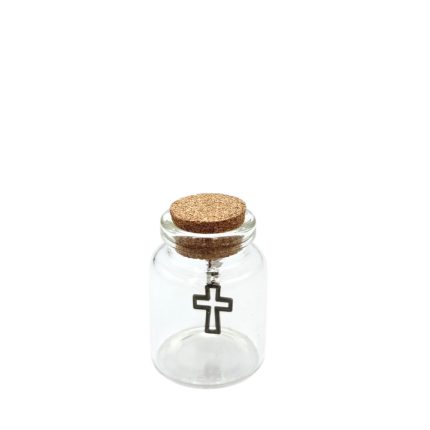Small clear glass bottle with a cork stopper containing a hanging metal cross charm inside.