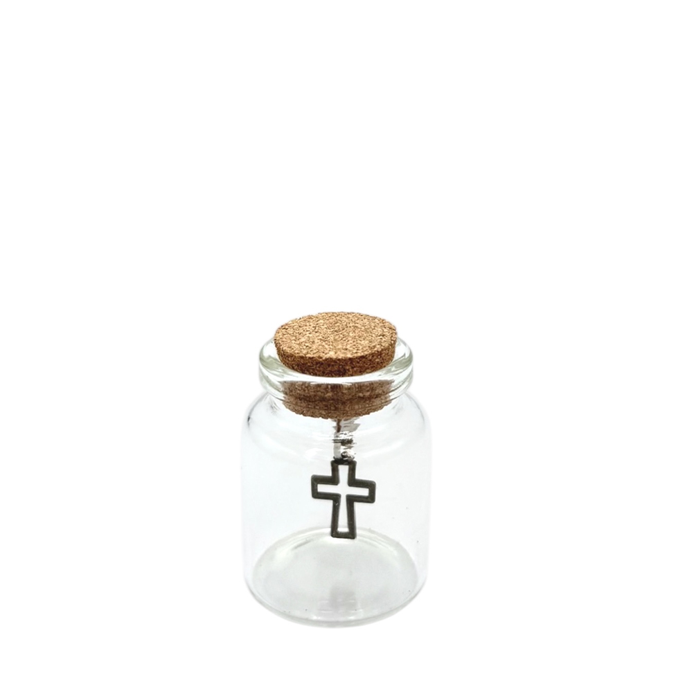 F8302AB3-4C89-942E-DA75-019CFC1F0E3C_11 | La Vie en Rose Small clear glass bottle with a cork stopper containing a hanging metal cross charm inside.