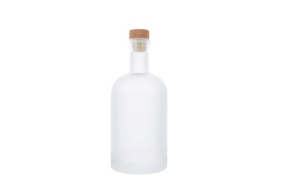 Frosted glass bottle with a cork stopper on a white background.