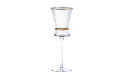 Elegant crystal champagne flute with a gold band around the bowl on a white background.