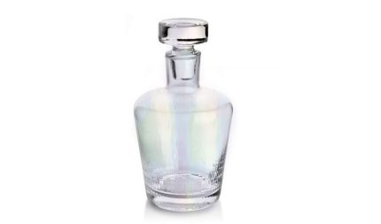 Glass crystal decanter bottle with a round stopper, empty and transparent to show clarity of the glass.
