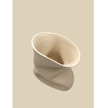Abstract cream ceramic sculpture with a twisted, funnel-like form set against a beige background, decorative object used for art display