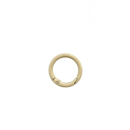 Cream-colored circular bracelet clasp with a small hinge.