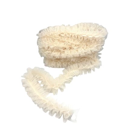 Cream-colored ruffled tulle trim coiled in a loose loop, decorative fabric edge for sewing or crafts.