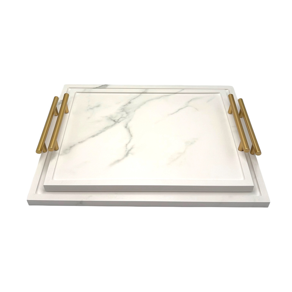 291575AA-7535-145E-41B8-019D9679DCAA_11 | La Vie en Rose Rectangular white marble cutting board with gold metal handles, stacked on a larger white board against a plain background.