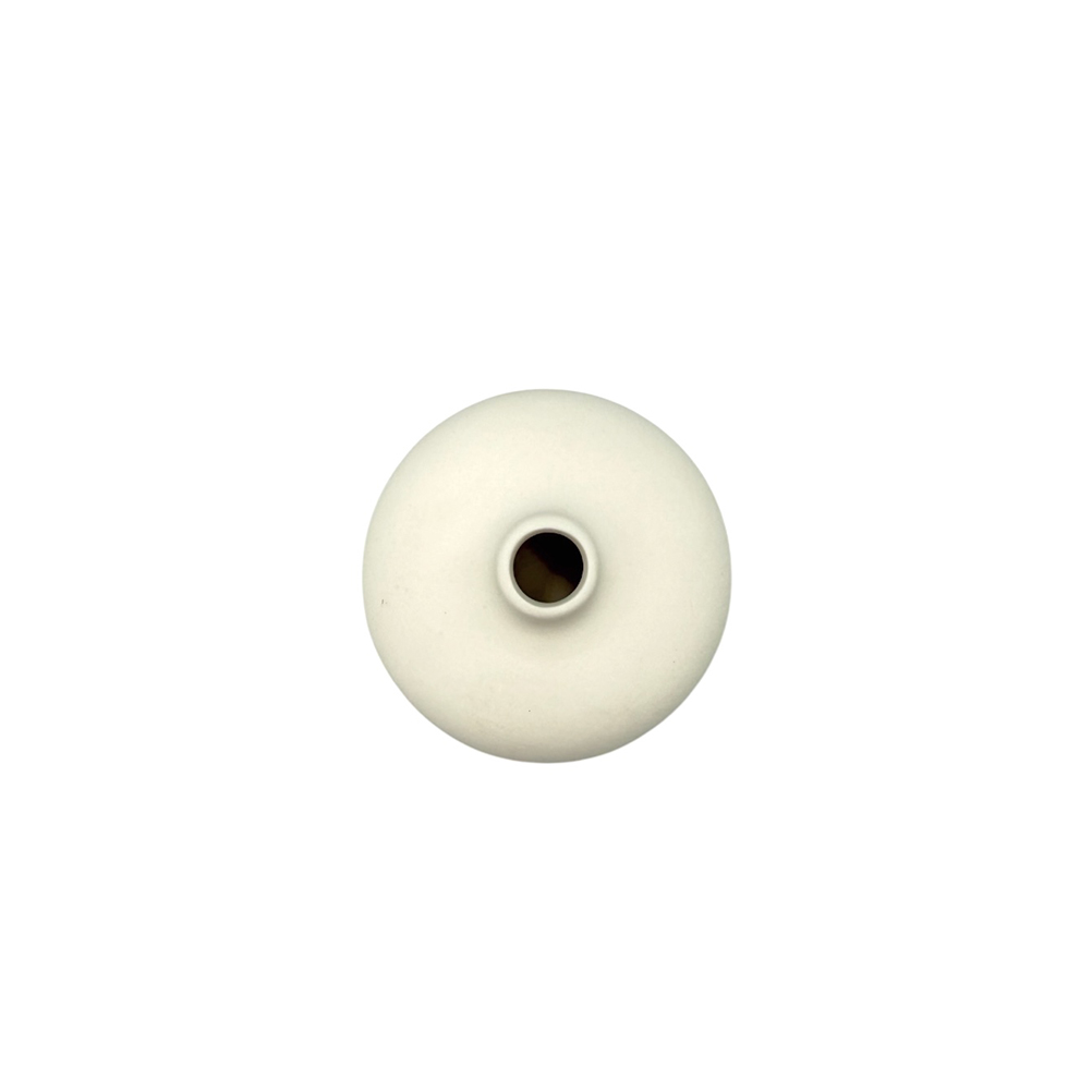 324E73F6-34E6-67DB-CF61-019D9B9EB89A_21 | La Vie en Rose White donut-shaped bead with a central hole in the middle of the image
