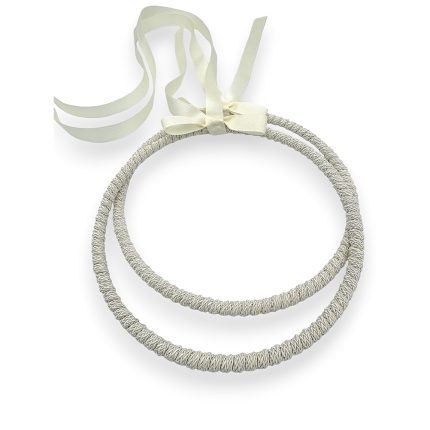 Silver braided headband with an ivory ribbon bow attached.