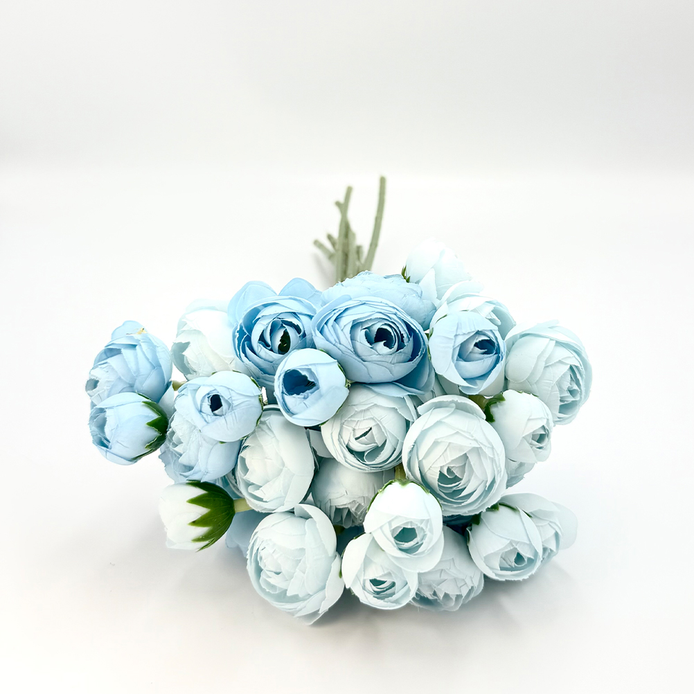 62C9EFE2-F187-57D9-0CD6-019C9A41B760_21 | La Vie en Rose Bouquet of light blue paper flowers tied together on a white background.