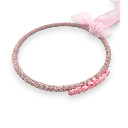 Pink braided bracelet with tiny pink rose beads and a soft pink ribbon tied at the end.
