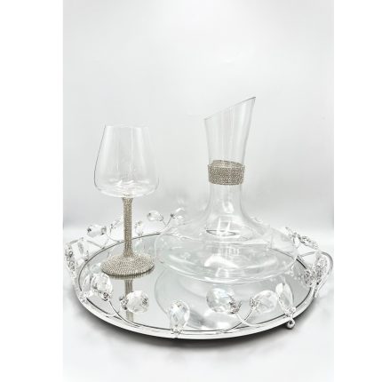 Crystal decanter and wine glass on a mirrored tray with hanging crystal bead accents.