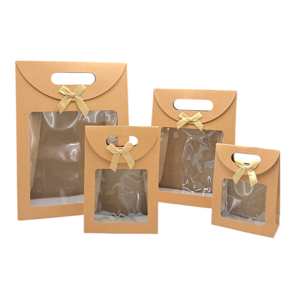 883E856B-C934-579C-7003-019DAADD9F59_21 | La Vie en Rose Set of kraft brown gift boxes with clear windows and beige ribbon bows in various sizes (gift packaging).