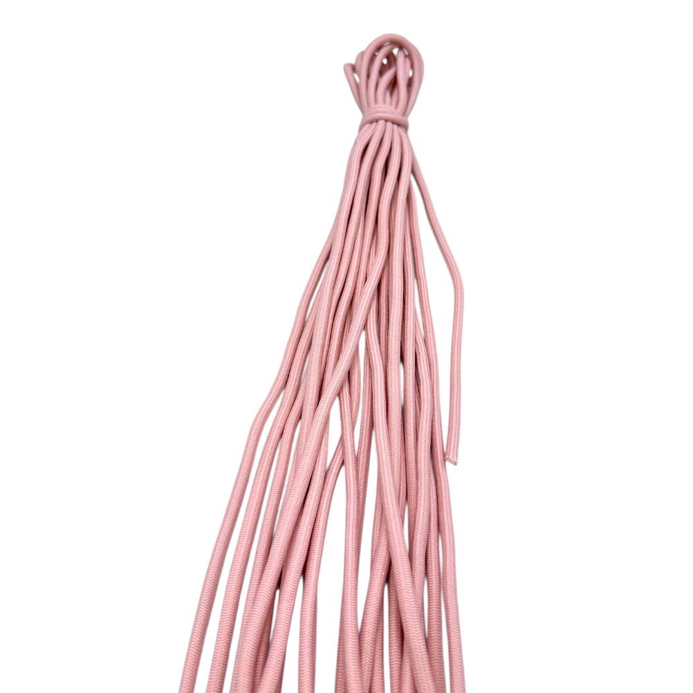 8E852092-0317-A99B-8230-019D29B642A2_11 | La Vie en Rose Bundle of pink cords hanging down from a tied loop at the top against a white background.