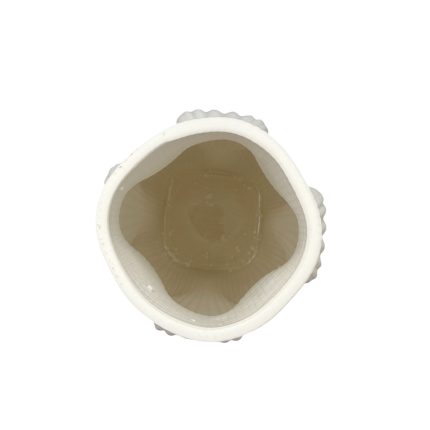 Top-down view of a white ribbed cylindrical container, open mouth and hollow interior.