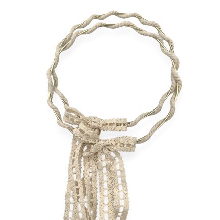 Beige twisted rope necklace tied with a lace ribbon bow at the bottom of a circular loop.