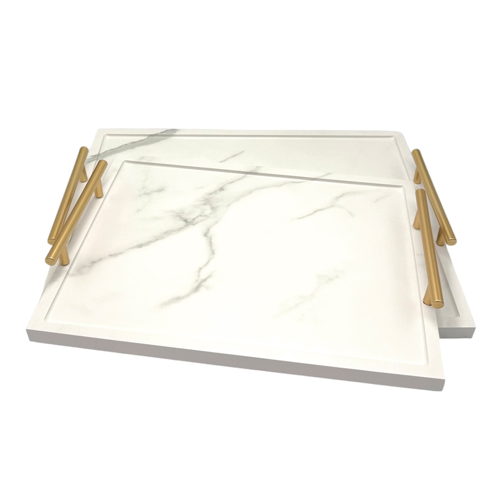 AC536E78-8D49-8E40-85A6-019D967A44C0_21 | La Vie en Rose Two white marble-pattern cutting boards with gold cylindrical handles, stacked together