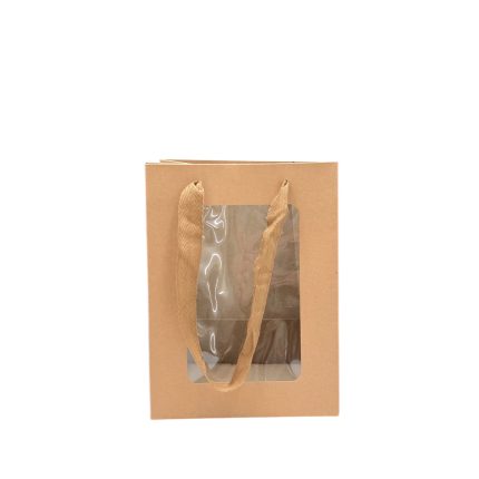 Brown kraft paper gift bag with a clear plastic window and two beige fabric handles.