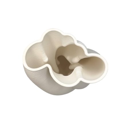 White three-lobed ceramic vase with a hollow interior, viewed from above.