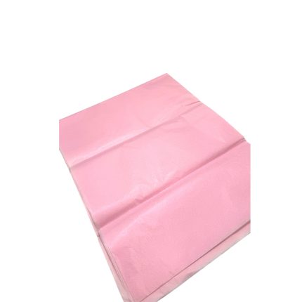 Pink tissue paper folded into a rectangular sheet on a white background.