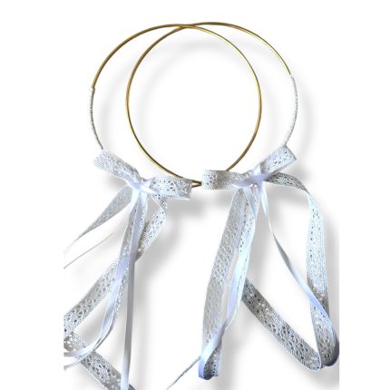 Gold wire halo headband with white lace ribbons tied into bows, hanging gracefully from the circles.