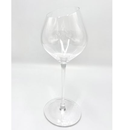 Clear wine glass with long stem photographed against a light background, empty and ready to use.